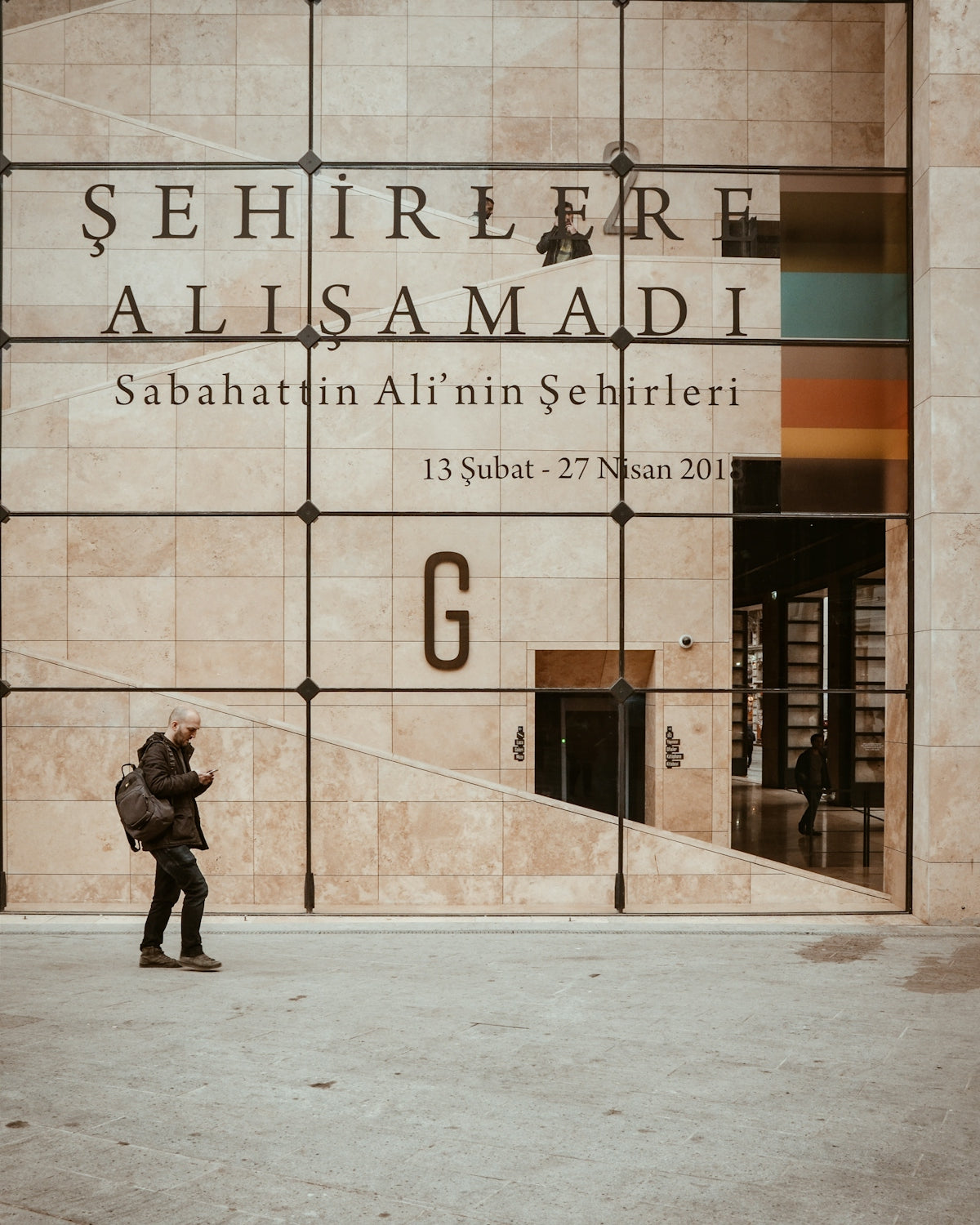 man walking beside structure