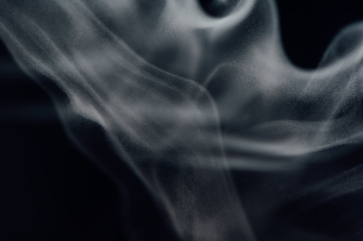white smoke in a dark room