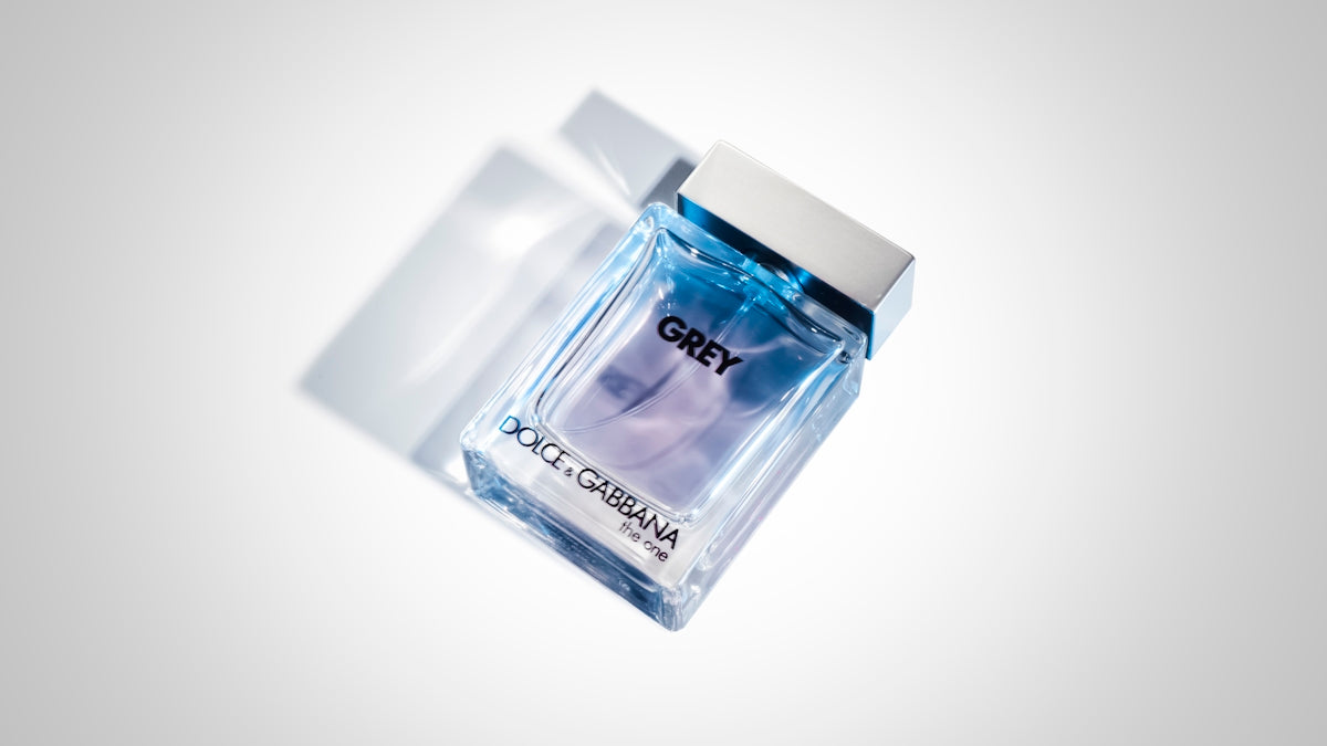 white and clear glass perfume bottle