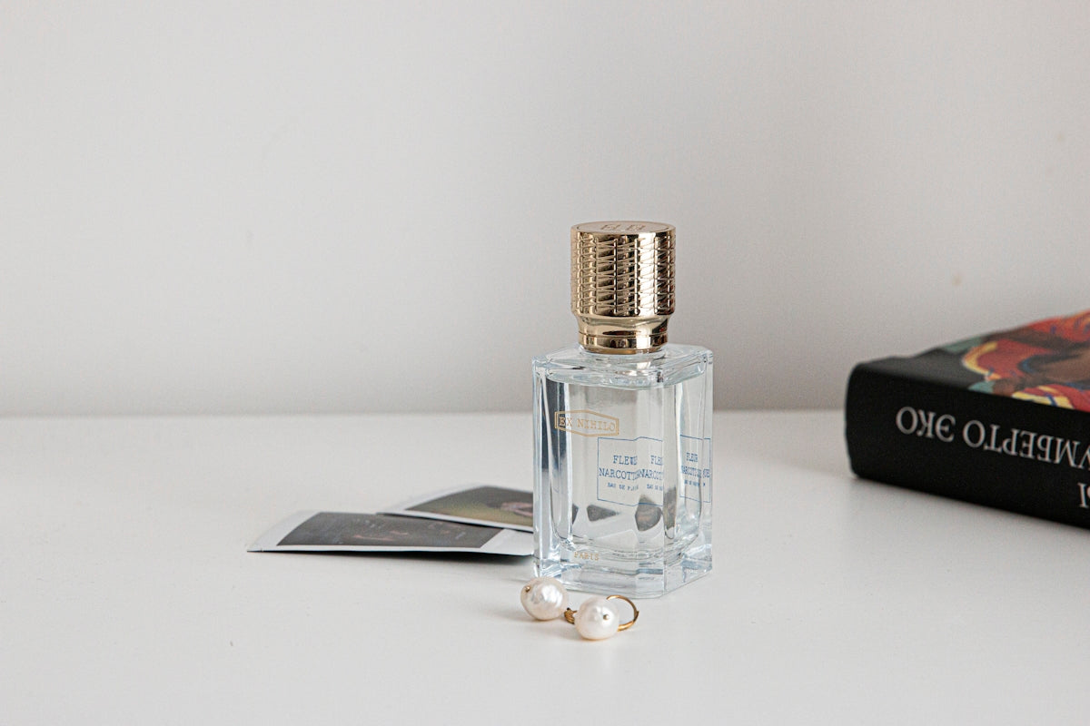 clear glass bottle with silver lid