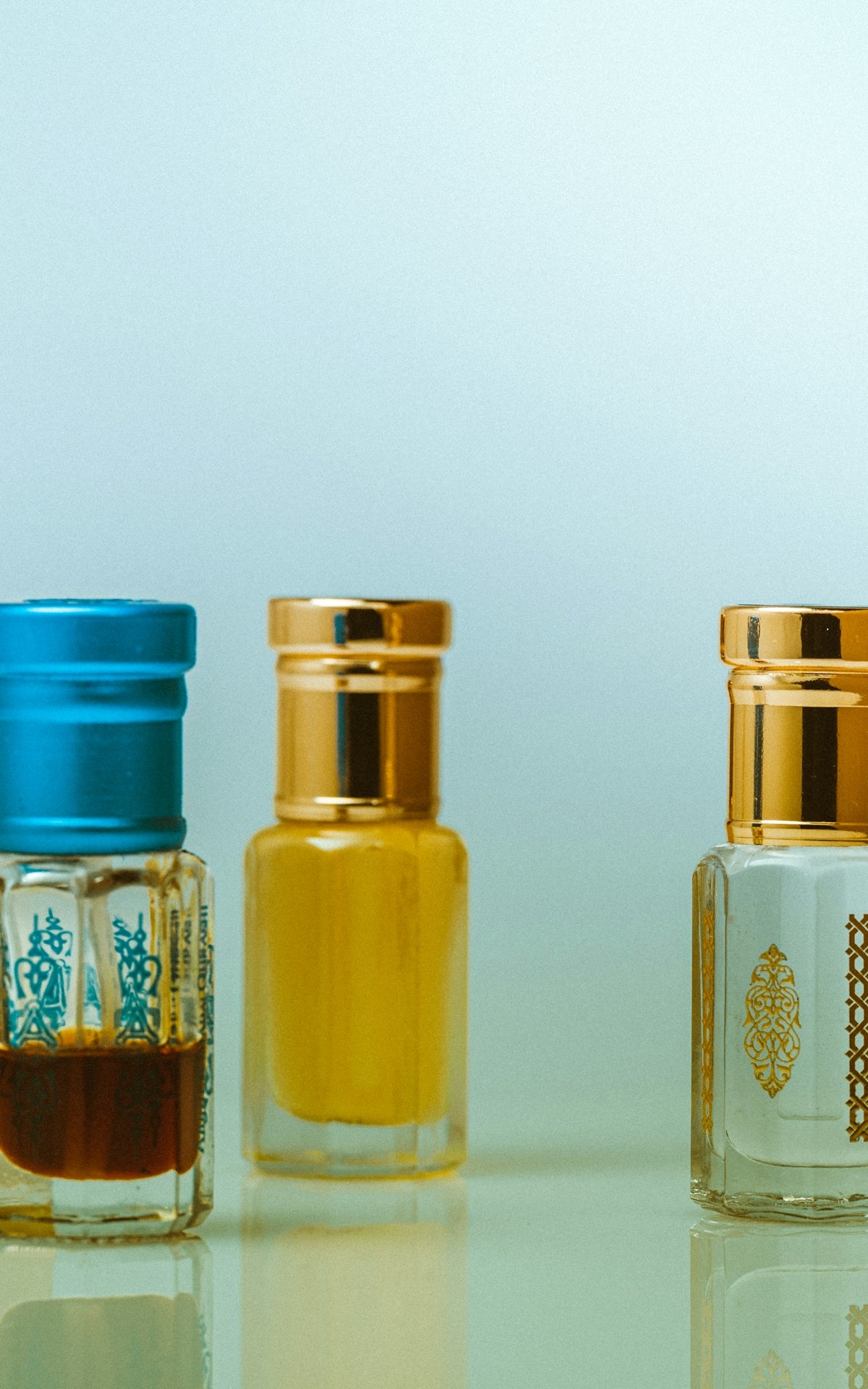 yellow and blue bottles on white table