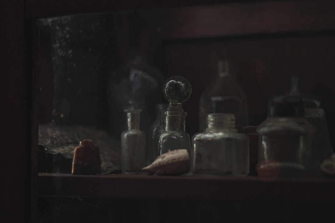 a shelf filled with bottles and other items
