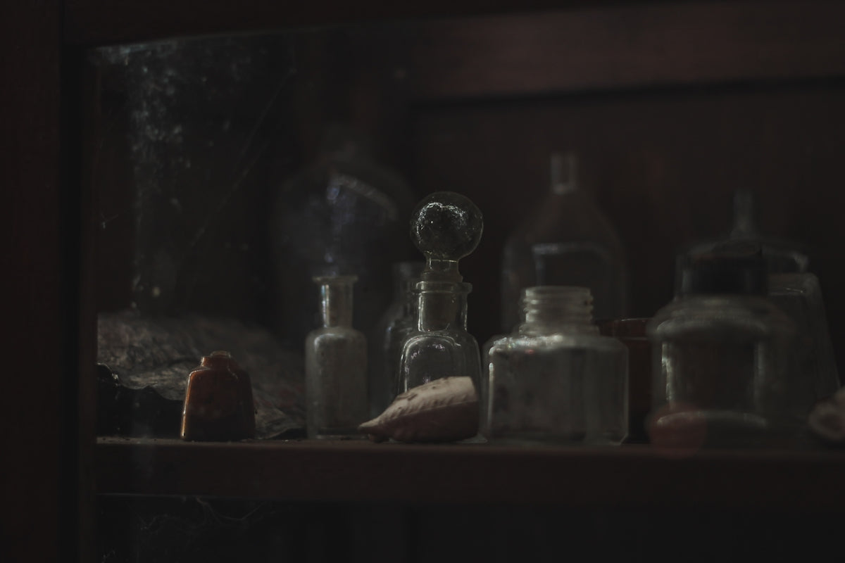 a shelf filled with bottles and other items
