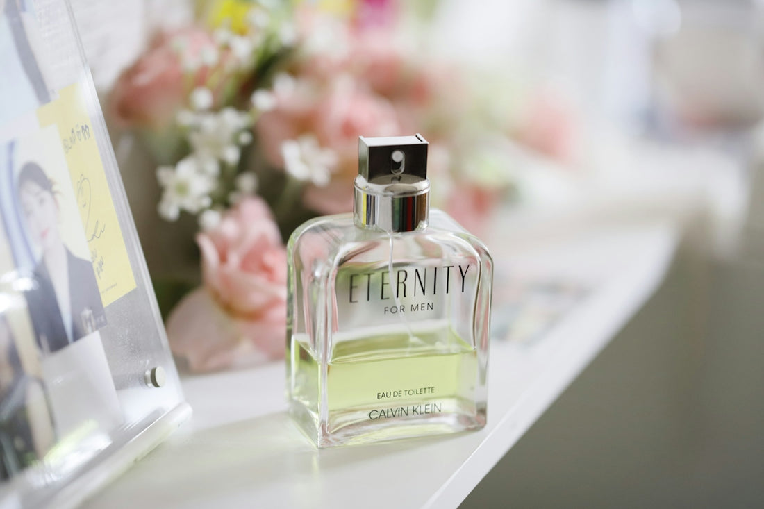 a bottle of perfume sitting on top of a table