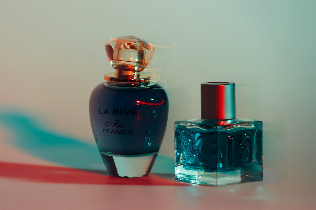 a bottle of perfume next to a bottle of perfume