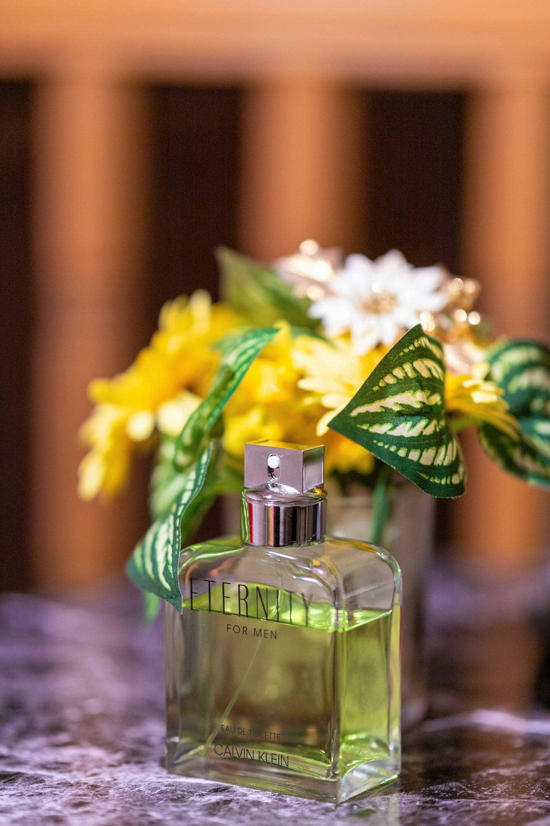 a bottle of perfume sitting on top of a table