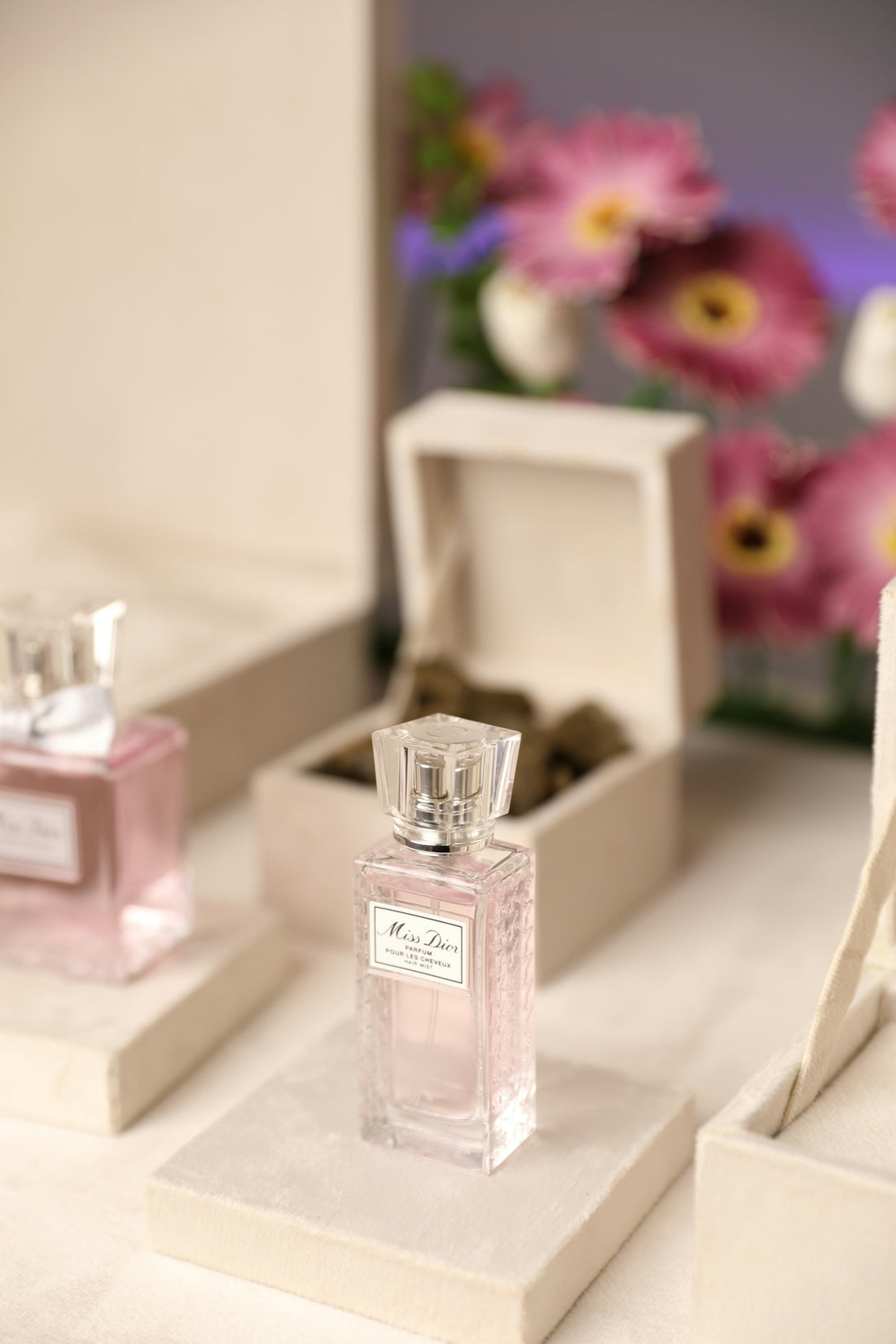 a couple of bottles of perfume sitting on top of a table