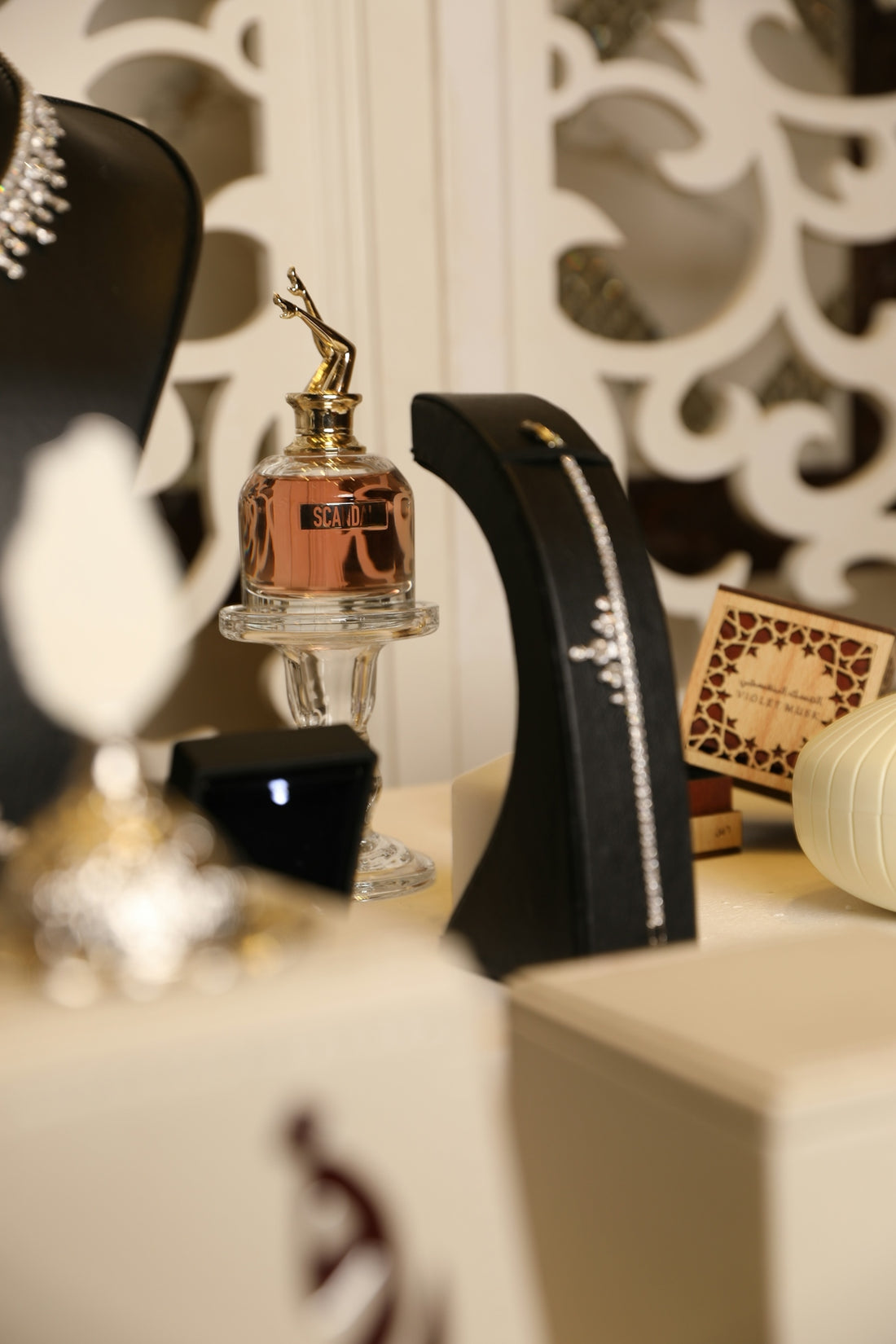 Jewelry and perfume are displayed elegantly.