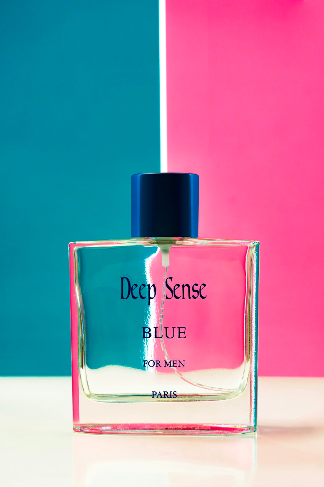 deep sense blue perfume bottle on a vibrant split background.